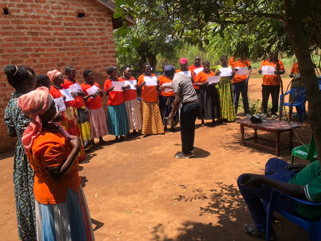 Participants stand together during an outdoor community activity.